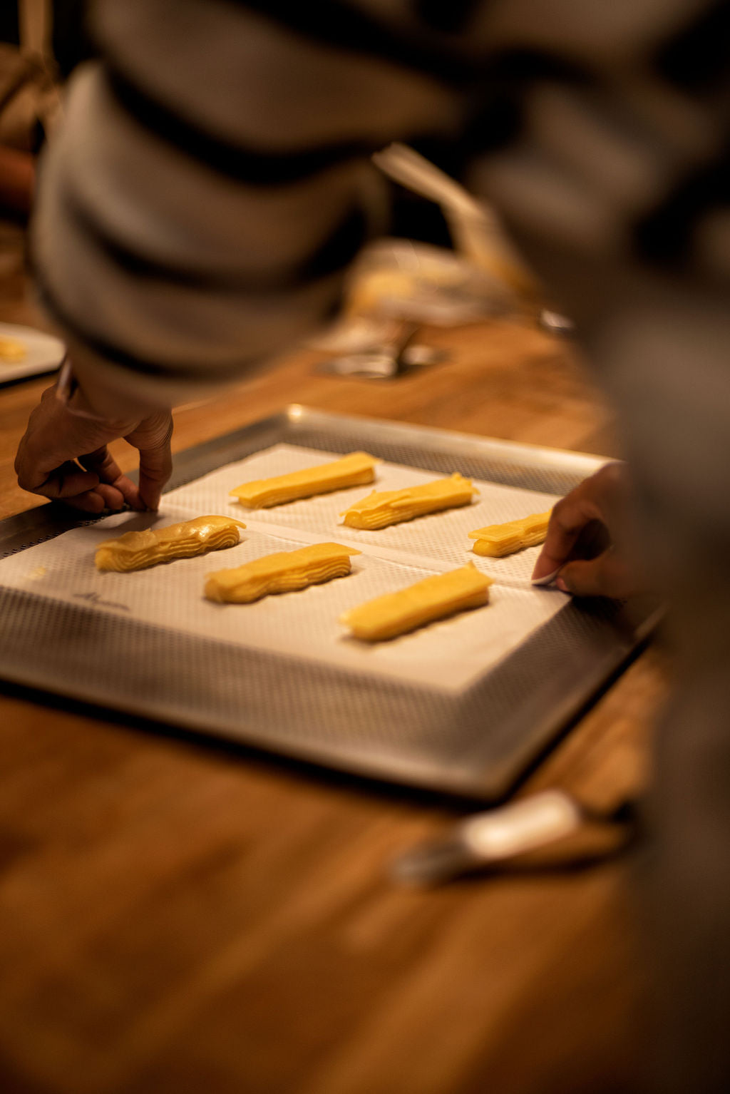 Close-up of a perfectly glazed eclair made during a hands-on baking class at Maison Fleuret Paris